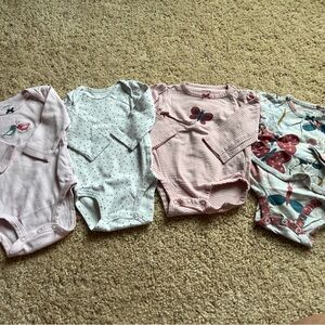 Bundle of 4 bodysuits for baby girl.